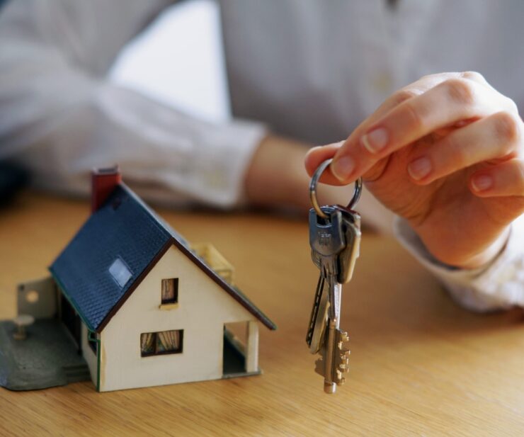 Closeup shot of a person thinking of buying or selling a house